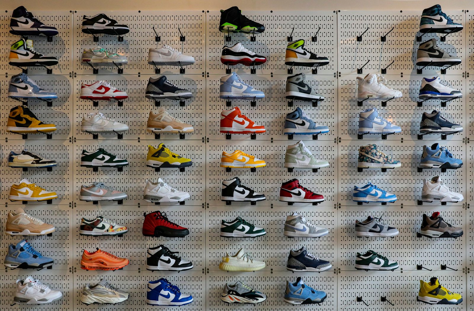 Wall display of many different shoes in a store