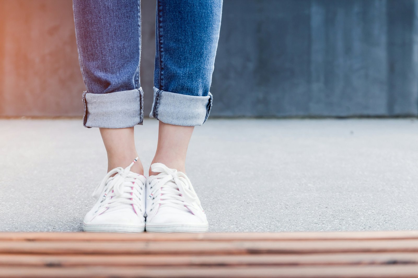 Person wearing white low-top casual sneakers