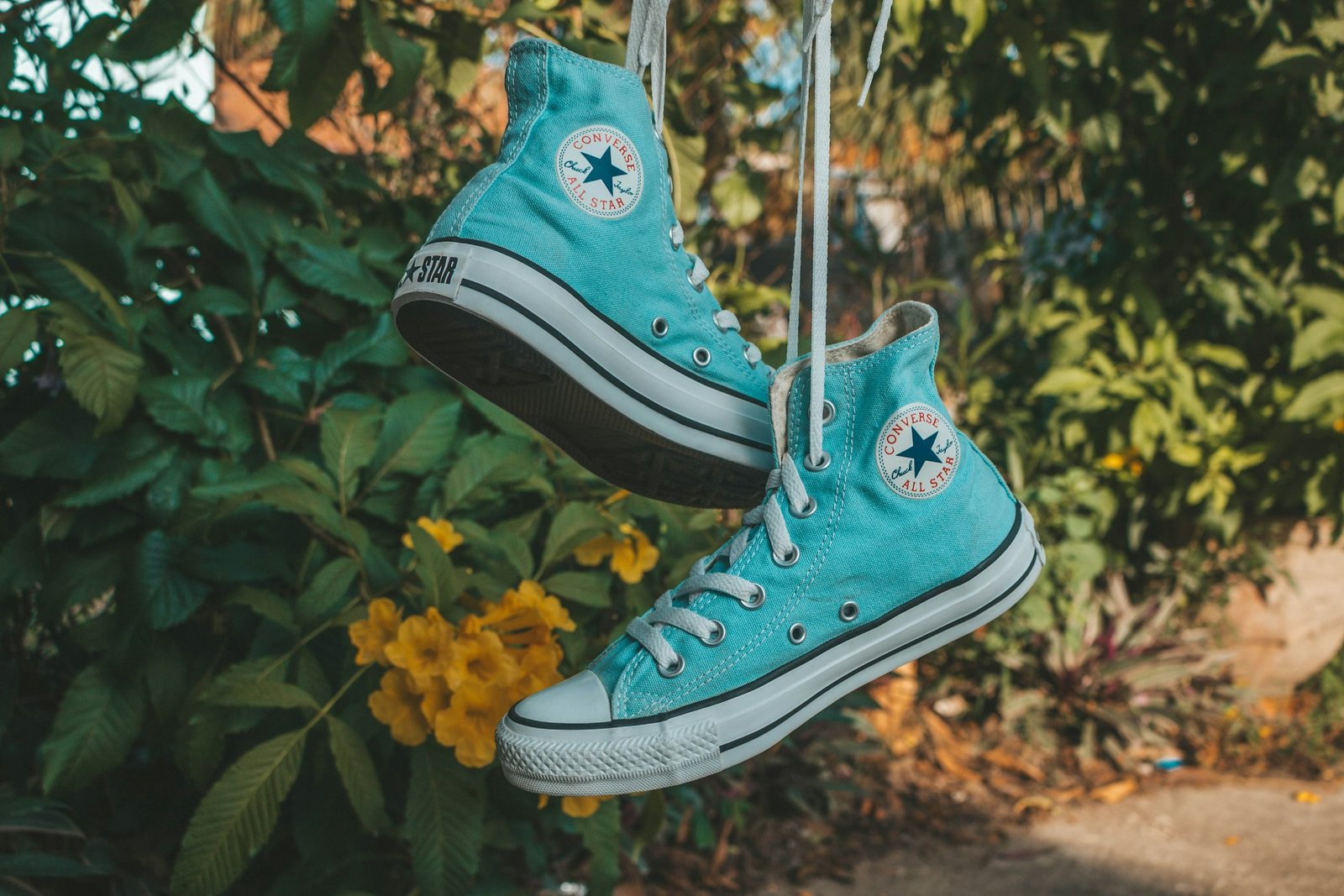 Pair of teal Converse All Star high-top sneakers