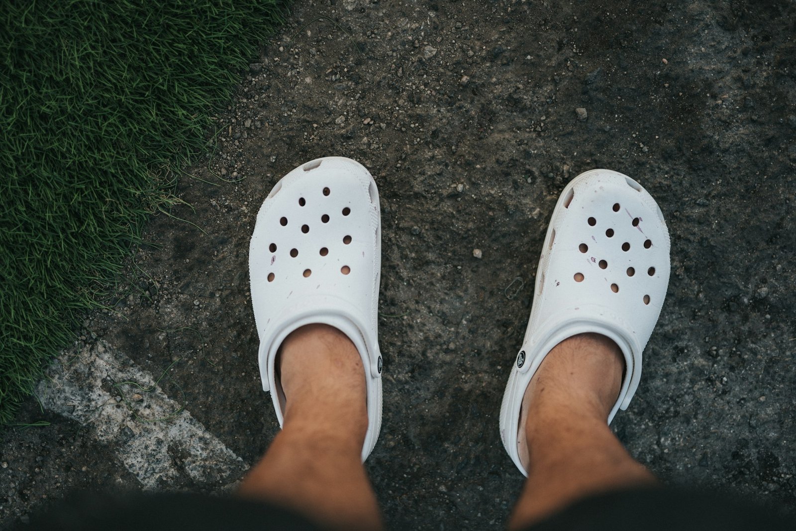 Person wearing white rubber clogs