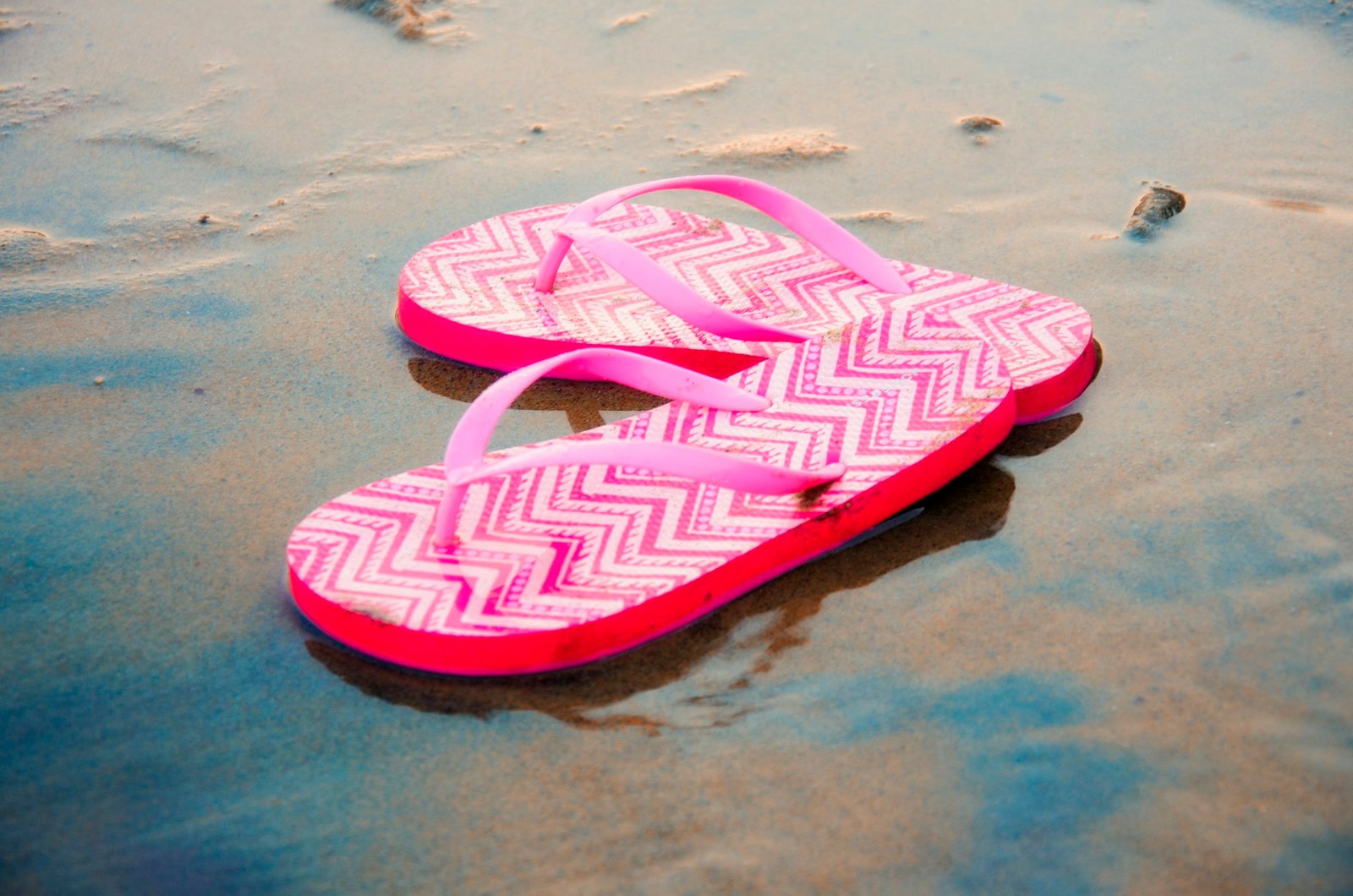 Pink and white flip-flops