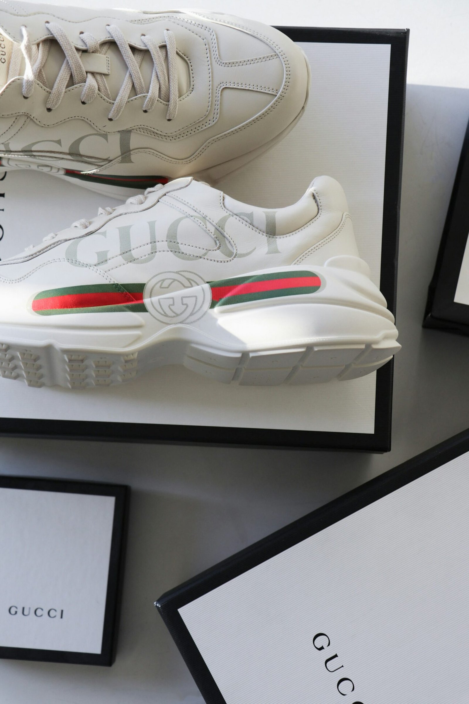 Pair of white Gucci sneakers with red and green stripe and box