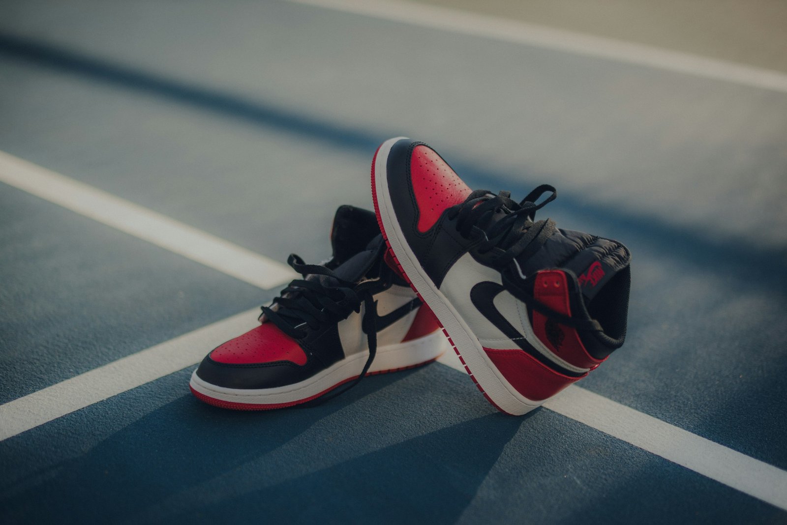 Pair of black, white and red Air Jordan 1 high-top sneakers