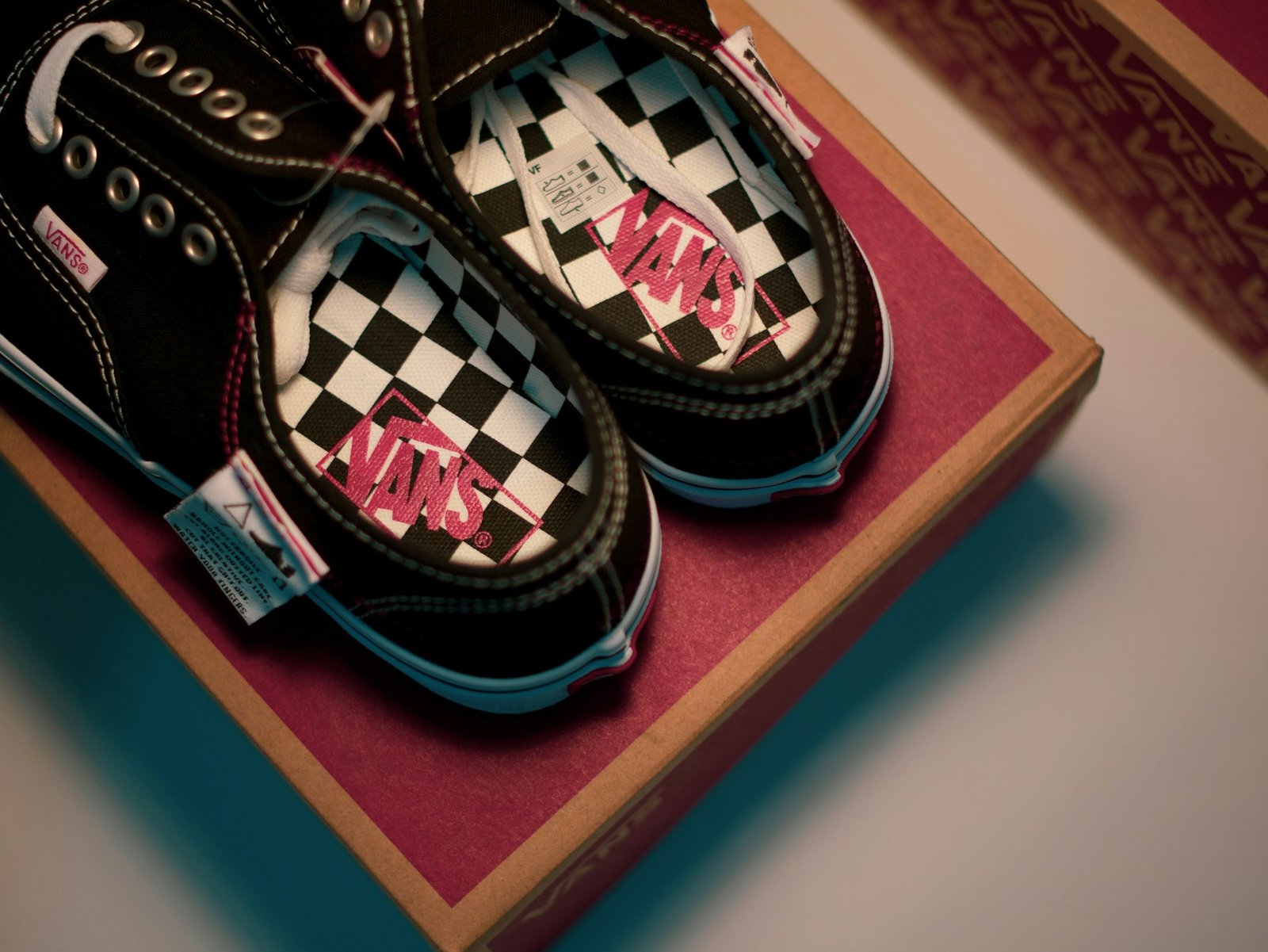 Pair of black and white checkerboard slip-on shoes