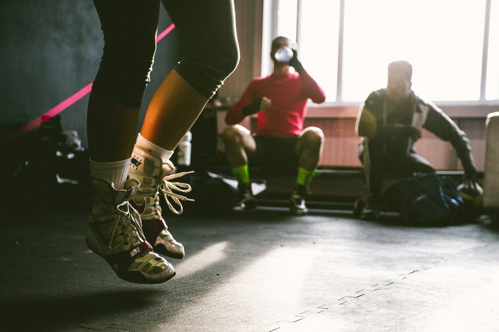 Person jumping in training shoes during a workout