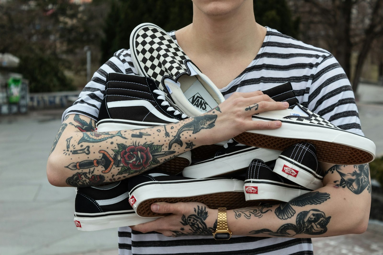 Rows of black Vans Sk8-Hi sneakers